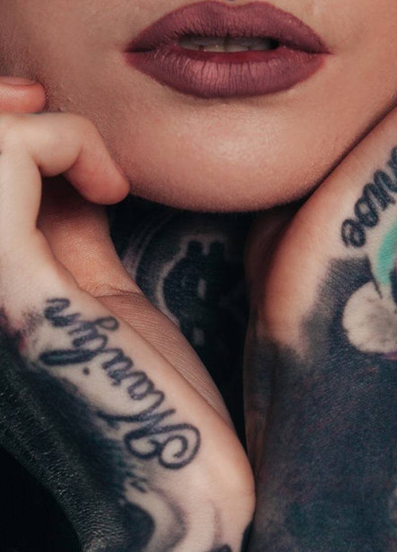 a close up of a tattoo on their face