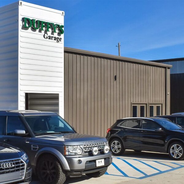 a car parked in front of a building a car parked in front of a building