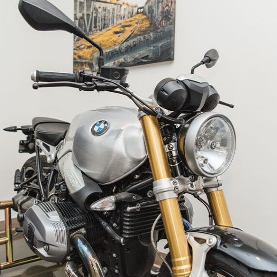 a motorcycle parked in front of a brick wall